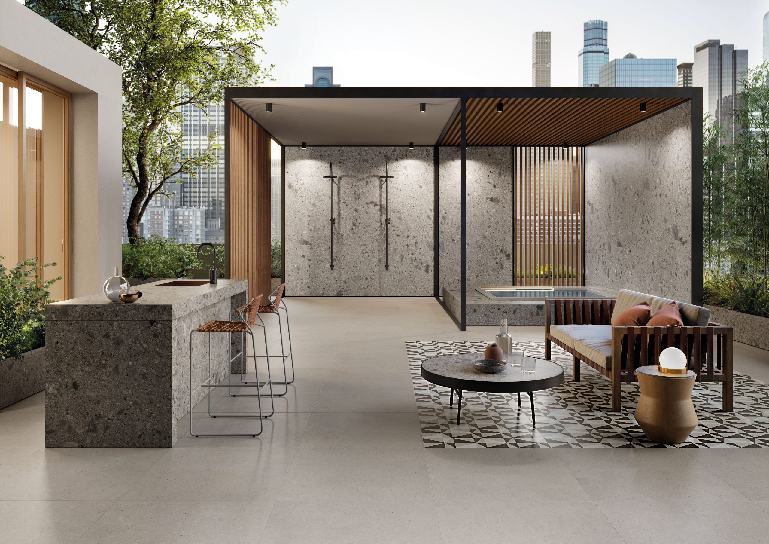 Grå utomhusklinker från Silver Grain på en möblerad terrass med utekök och pergola.
